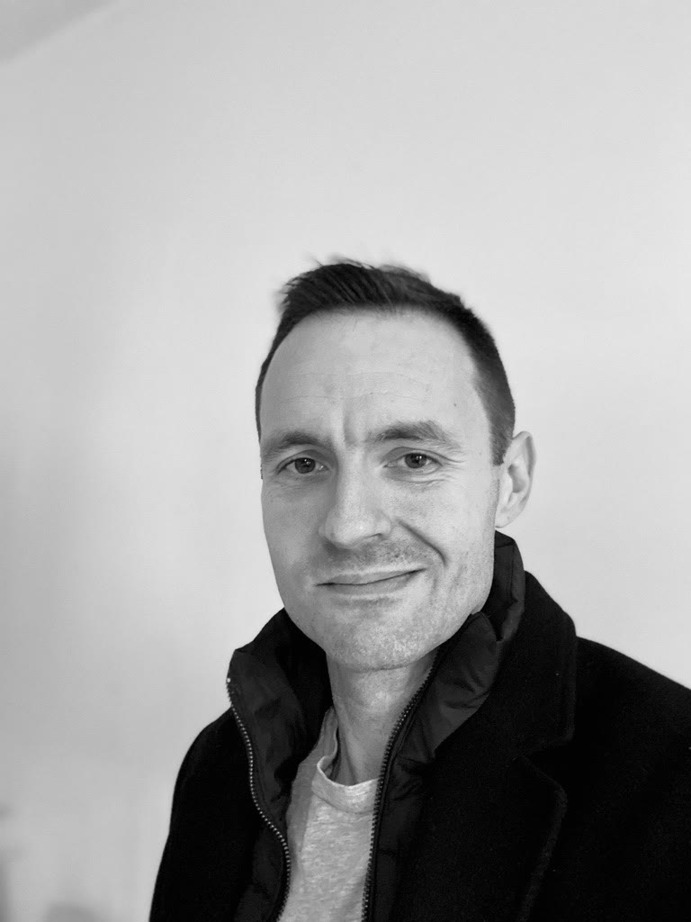 Black-and-white portrait of Gavan Grenville-Hunt